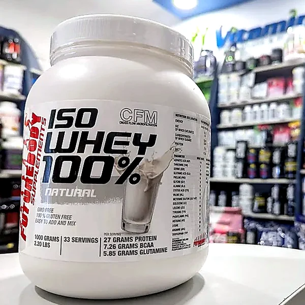 A tub of ISO Whey 100% Natural protein powder on the shop counter
